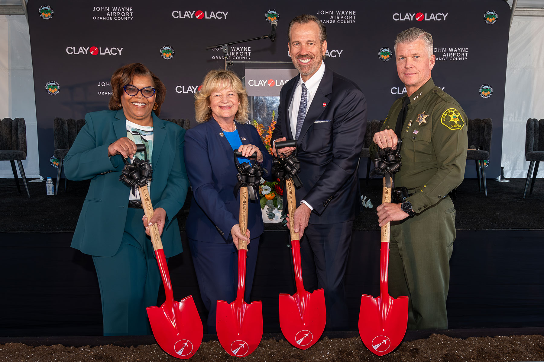 Pictured from left are John Wayne Airport Director Charlene Reynolds; Supervisor Katrina Foley, Fifth District, County of Orange; Clay Lacy Chairman and Owner Brian Kirkdoffer, and OCSD Undersheriff Jeff Hallock. Photo courtesy of Clay Lacy Aviation.