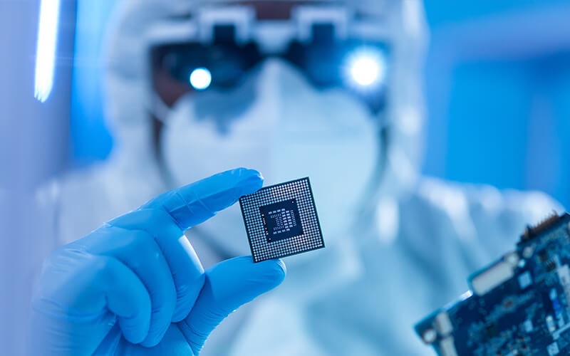 Lab technician holding a microchip