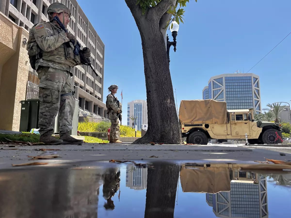 Armed law enforcement standing outside a building