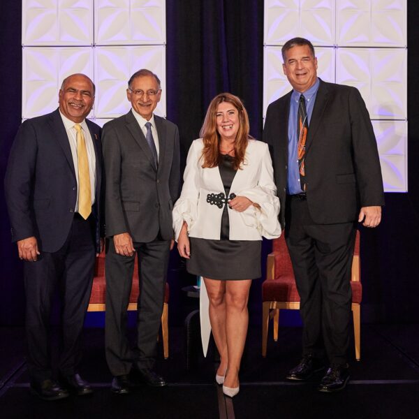 From left to right: Sri Sundaram, Dean of the College of Business and Economics at CSUF; Dr. Anil K. Puri, Provost Emeritus and Director of the Woods Center for Economic Analysis and Forecasting at CSUF; Dr. Mira Farka, Professor of Economics and Co-Director of the Woods Center for Economic Analysis and Forecasting at CSUF; and Jeff Ball, President and CEO of Orange County Business Council.